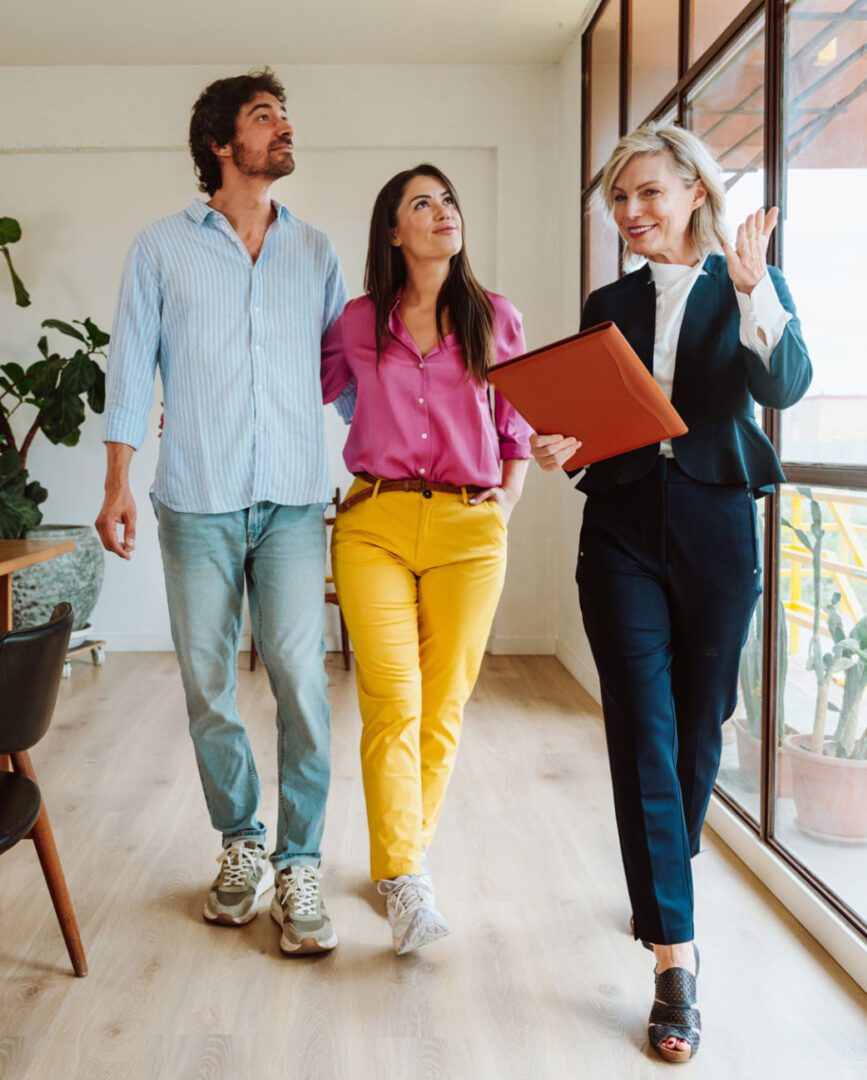 Real estate agent showing couple a property