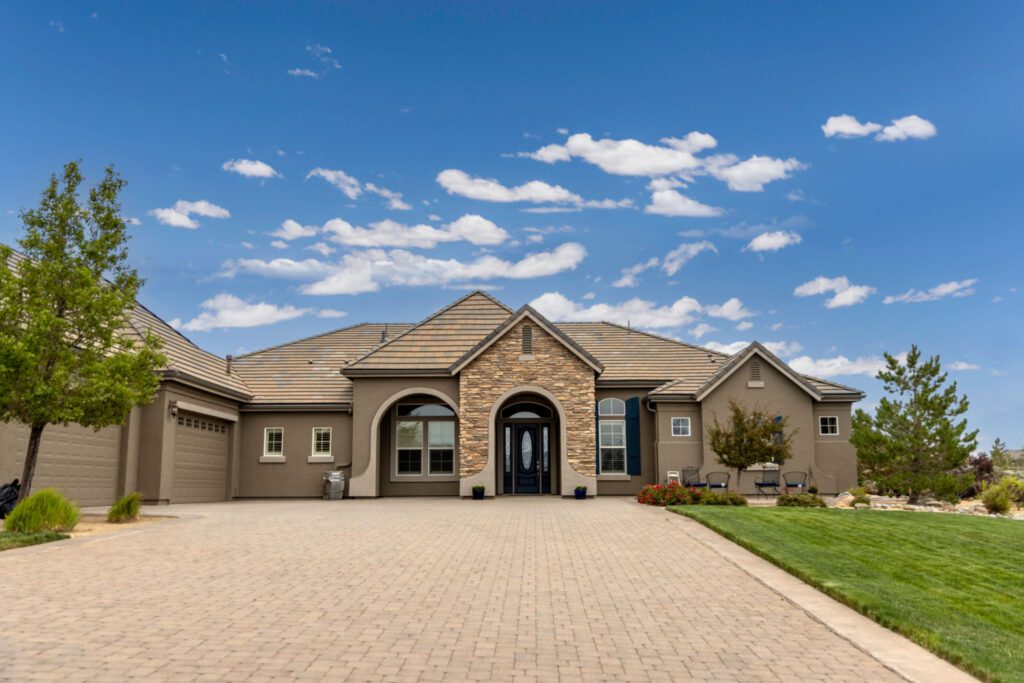 Spacious driveway leading to a large home