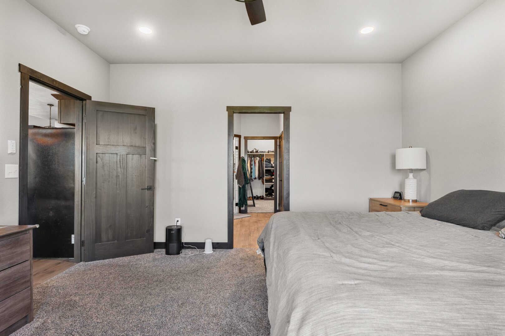 Cozy bedroom with neutral tones and modern decor.